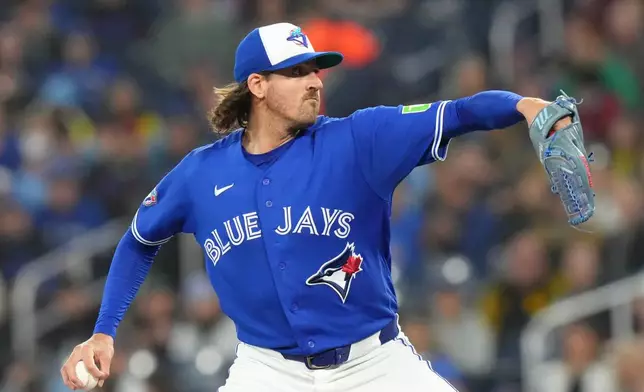 Toronto Blue Jays pitcher Kevin Gausman (34) works against the Cleveland Guardians during the first inning of a baseball game in Toronto, Saturday, April 25, 2026. (Chris Young/The Canadian Press via AP)