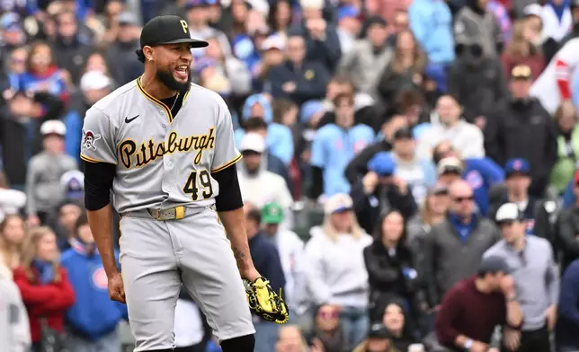 Pittsburgh Pirates pitcher Yohan Ramírez celebrates after a baseball game against the Chicago Cubs, Saturday, April 11, 2026, in Chicago. (AP Photo/Matt Marton)
