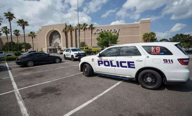 Law enforcement personnel respond to reports of a shooting at Mall of Louisiana in Baton Rouge, La., Thursday, April 23, 2026. (AP Photo/Matthew Hinton)