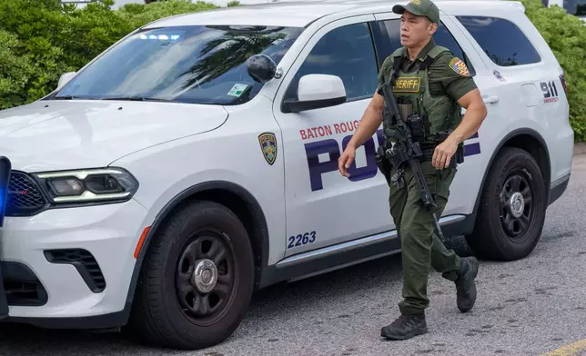 Law enforcement personnel respond to reports of a shooting at Mall of Louisiana in Baton Rouge, La., Thursday, April 23, 2026. (AP Photo/Matthew Hinton)