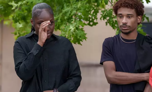 People react after a mass shooting at the Mall of Louisiana, Thursday, April 23, 2026, in Baton Rouge, La. (AP Photo/Matthew Hinton)