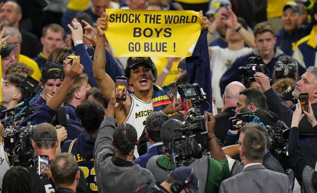 Michigan's Yaxel Lendeborg celebrates after defeating UConn in the NCAA college basketball tournament national championship game at the Final Four, Monday, April 6, 2026, in Indianapolis. (AP Photo/AJ Mast)