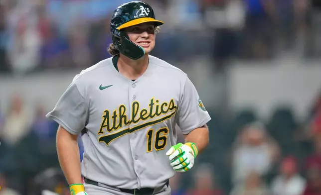 Athletics' Nick Kurtz reacts after hitting a solo home run on the first pitch of the game against Texas Rangers starting pitcher Nathan Eovaldi during a baseball game Friday, April 24, 2026, in Arlington, Texas. (AP Photo/Julio Cortez)