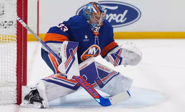 New York Islanders goaltender David Rittich protects the net during the first period of an NHL hockey game against the Carolina Hurricanes Tuesday, April 14, 2026, in Elmont, N.Y. (AP Photo/Frank Franklin II)