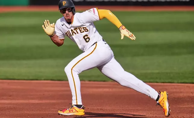 Pittsburgh Pirates' Konnor Griffin sprints for home to score a run during the second inning of a baseball game against the San Diego Padres in Pittsburgh, Friday, April 3, 2026. (AP Photo/Gene J. Puskar)