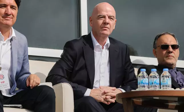 FIFA President Gianni Infantino, center, follows a friendly soccer match between Iran and Costa Rica, in Antalya, southern Turkey, Tuesday, March 31, 2026. (AP Photo/Riza Ozel)