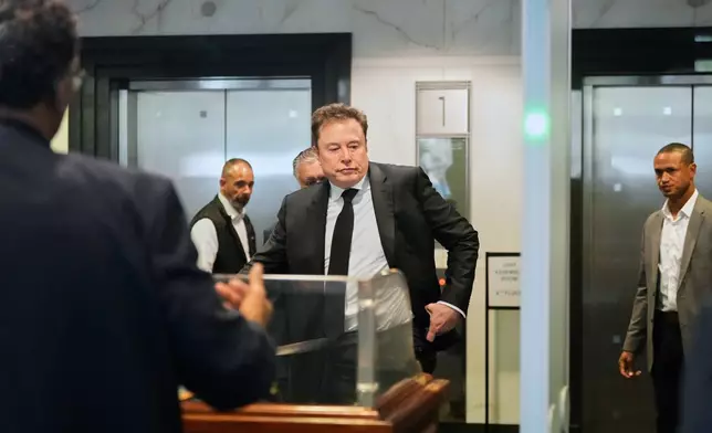 Elon Musk arrives at the U.S. District Court in Oakland, Calif., Tuesday, April 28, 2026. (AP Photo/Godofredo A. Vásquez)