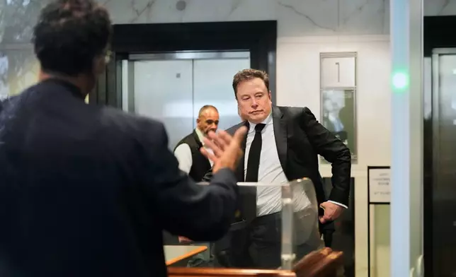 Elon Musk arrives at the U.S. District Court in Oakland, Calif., Tuesday, April 28, 2026. (AP Photo/Godofredo A. Vásquez)