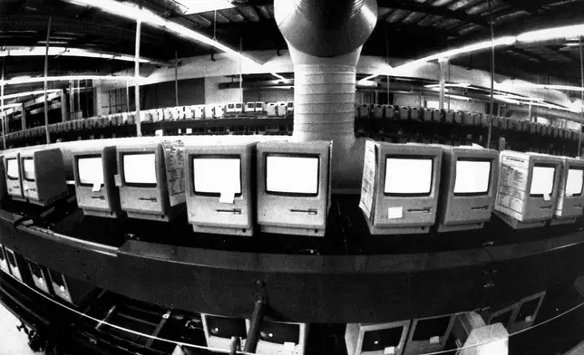 FILE - In this March 28, 1984, file photo, thousands of Apple Macintosh computers sit on double decked manufacturing lines. (AP Photo/Paul Sakuma, File)