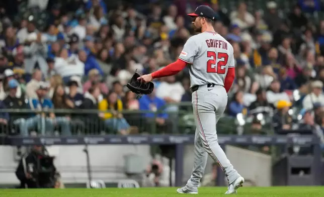 Washington Nationals' Foster Griffin walks to the dugout after being taken out during the sixth inning of a baseball game against the Milwaukee Brewers, Saturday, April 11, 2026, in Milwaukee. (AP Photo/Aaron Gash)