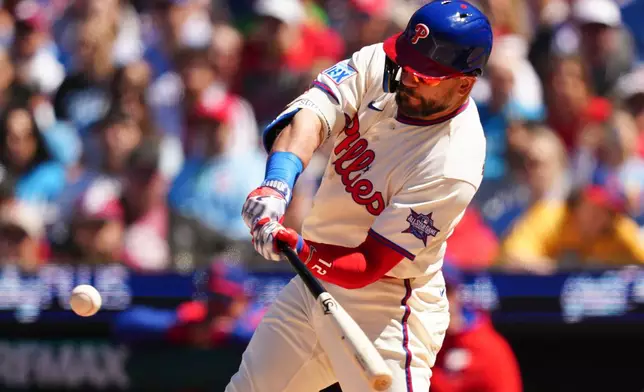 Philadelphia Phillies' Kyle Schwarber hits a three-run home run off Arizona Diamondbacks pitcher Brandon Pfaadt during the third inning of a baseball game, Saturday, April 11, 2026, in Philadelphia. (AP Photo/Derik Hamilton)