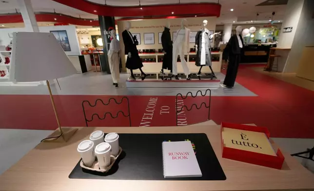 An installation of the new movie 'Devil Wears Prada 2' is displayed at La Rinascente shopping center, in Milan, Italy, Monday, April 20, 2026. (AP Photo/Luca Bruno)