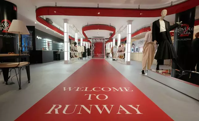 An installation of the new movie 'Devil Wears Prada 2' is displayed at La Rinascente shopping center, in Milan, Italy, Monday, April 20, 2026. (AP Photo/Luca Bruno)