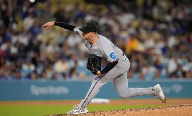 Miami Marlins starting pitcher Janson Junk throws to the plate during the third inning of a baseball game against the Los Angeles Dodgers, Tuesday, April 28, 2026, in Los Angeles. (AP Photo/Mark J. Terrill)