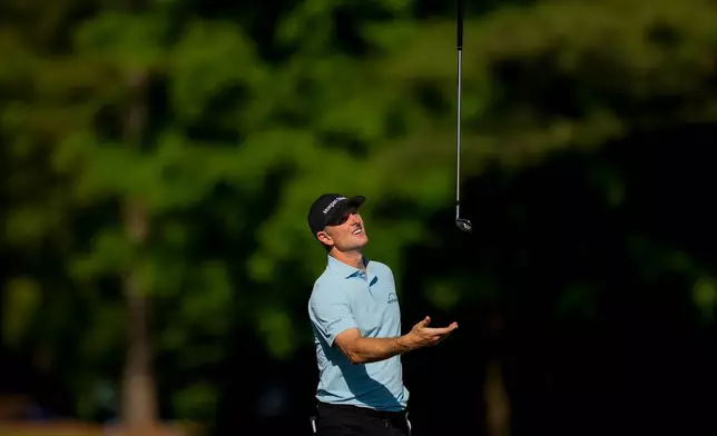 Justin Rose, of England, reacts to his tee shot on the 12th hole during the third round of the Masters golf tournament at the Augusta National Golf Club, Saturday, April 11, 2026, in Augusta, Ga. (AP Photo/Gerald Herbert)