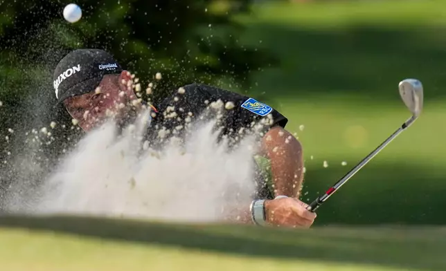 Shane Lowry, of Ireland, hits from the bunker on the 10th hole during the final round of the Masters golf tournament at the Augusta National Golf Club, Sunday, April 12, 2026, in Augusta, Ga. (AP Photo/Eric Gay)