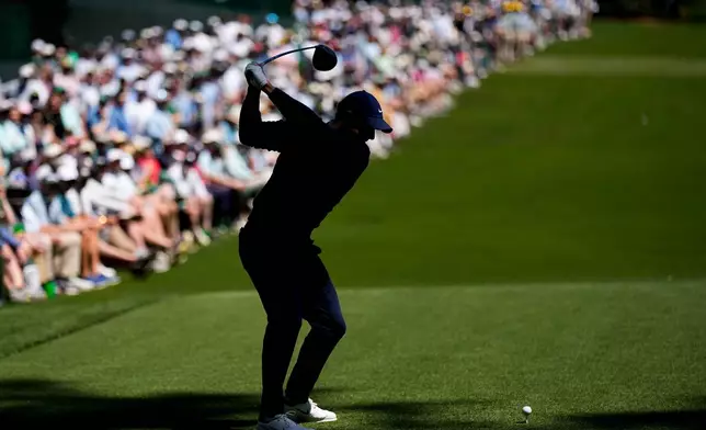 Rory McIlroy, of Northern Ireland, hits his tee shot on the 14th hole during the first round of the Masters golf tournament at the Augusta National Golf Club, Thursday, April 9, 2026, in Augusta, Ga. (AP Photo/David J. Phillip)