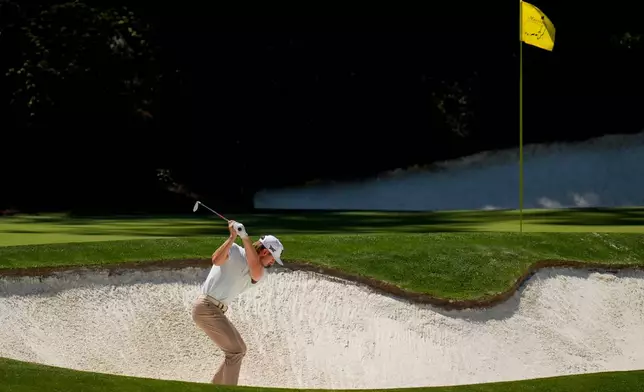 Jake Knapp hits from the bunker on the 12th hole during the first round of the Masters golf tournament at the Augusta National Golf Club, Thursday, April 9, 2026, in Augusta, Ga. (AP Photo/Eric Gay)
