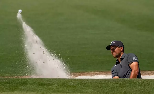 Xander Schauffele hits from the bunker on the second hole during the second round of the Masters golf tournament at the Augusta National Golf Club, Friday, April 10, 2026, in Augusta, Ga. (AP Photo/Gerald Herbert)