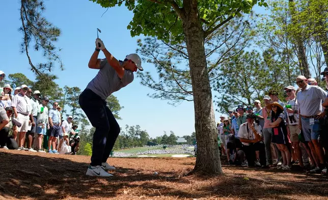 Rory McIlroy, of Northern Ireland, hits from the pine straw on the second hole during the third round of the Masters golf tournament at the Augusta National Golf Club, Saturday, April 11, 2026, in Augusta, Ga. (AP Photo/Eric Gay)