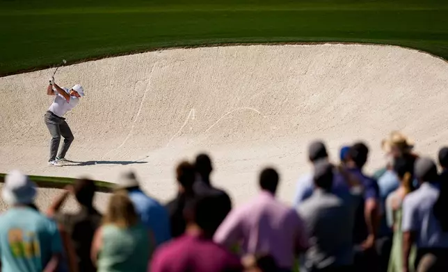 Rory McIlroy, of Northern Ireland, hits from the bunker on the eighth hole during the second round of the Masters golf tournament at the Augusta National Golf Club, Friday, April 10, 2026, in Augusta, Ga. (AP Photo/David J. Phillip)