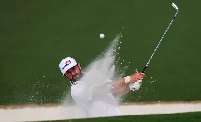 Cameron Young hits from the bunker on the second hole during the first round of the Masters golf tournament at the Augusta National Golf Club, Thursday, April 9, 2026, in Augusta, Ga. (AP Photo/David J. Phillip)