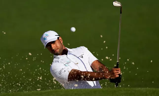 Aaron Rai, of England, hits from the bunker on the second hole during the second round of the Masters golf tournament at the Augusta National Golf Club, Friday, April 10, 2026, in Augusta, Ga. (AP Photo/David J. Phillip)