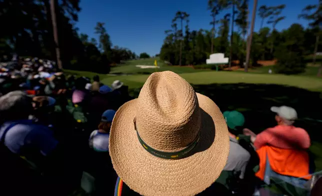 Patrons watch on the 10th hole during the first round of the Masters golf tournament at the Augusta National Golf Club, Thursday, April 9, 2026, in Augusta, Ga. (AP Photo/Gerald Herbert)