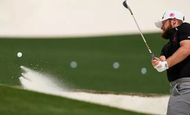 Tyrrell Hatton, of England, warms up on the driving range before a practice round ahead of the Masters golf tournament at the Augusta National Golf Club, Tuesday, April 7, 2026, in Augusta, Ga. (AP Photo/Ashley Landis)