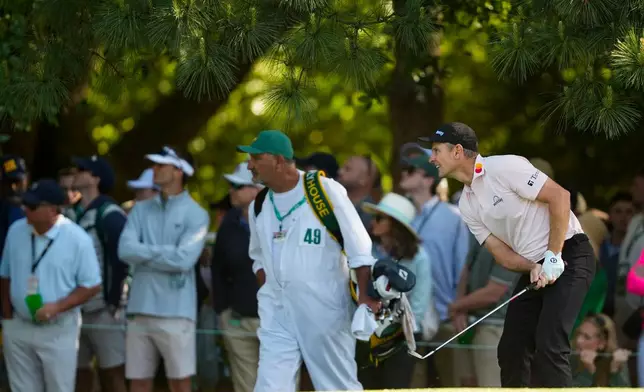 Justin Rose, of England, hits from the rough on the first hole during the second round of the Masters golf tournament at the Augusta National Golf Club, Friday, April 10, 2026, in Augusta, Ga. (AP Photo/Gerald Herbert)