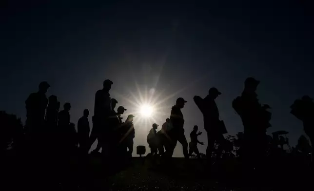 Patrons arrive for the second round of the Masters golf tournament at the Augusta National Golf Club, Friday, April 10, 2026, in Augusta, Ga. (AP Photo/Matt Slocum)
