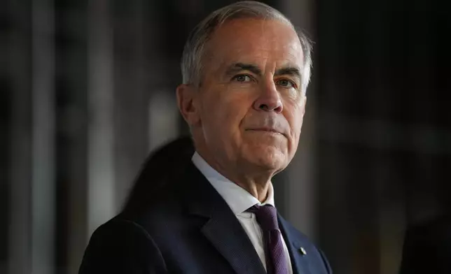 Prime Minister Mark Carney prepares to make an announcement in Brampton, Ont. on Tuesday April 7 2026. (Chris Young /The Canadian Press via AP)