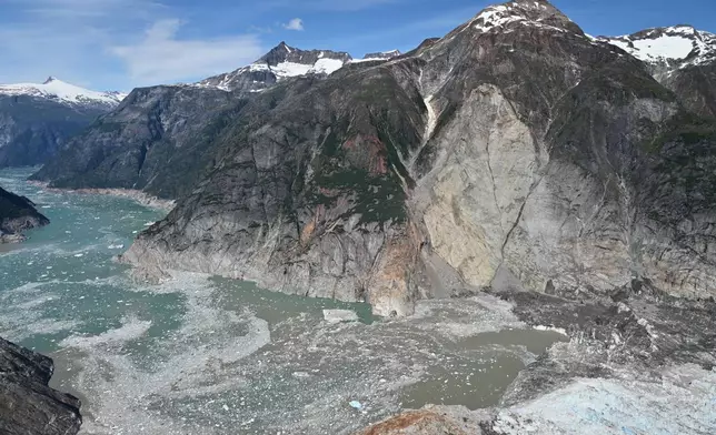 This photo provided by the U.S. Geological Survey shows the slope where a landslide occurred days earlier near the terminus of the South Sawyer Glacier, lower right, in Tracy Arm fjord about 80 miles southeast of Juneau, Alaska, on Aug. 13, 2025. (John Lyons/U.S. Geological Survey via AP)