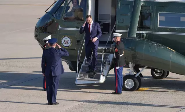 Vice President JD Vance walks off Marine Two to walk and board Air Force Two, Friday, April 10, 2026, at Joint Base Andrews, Md., for expected departure to Pakistan, for talks on Iran. (AP Photo/Jacquelyn Martin, pool)