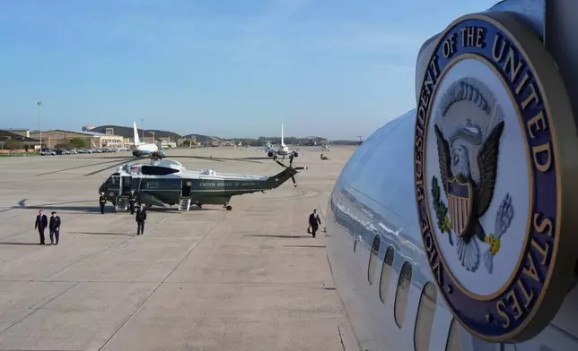 Vice President JD Vance aboard, walking far left, arrives, Friday, April 10, 2026, at Joint Base Andrews, Md., where Vance will board Air Force Two, seal right, and depart to Pakistan, for talks on Iran. (AP Photo/Jacquelyn Martin, pool)