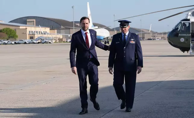 Vice President JD Vance walks to board Air Force Two, Friday, April 10, 2026, at Joint Base Andrews, Md., for expected departure to Pakistan, for talks on Iran. (AP Photo/Jacquelyn Martin, pool)
