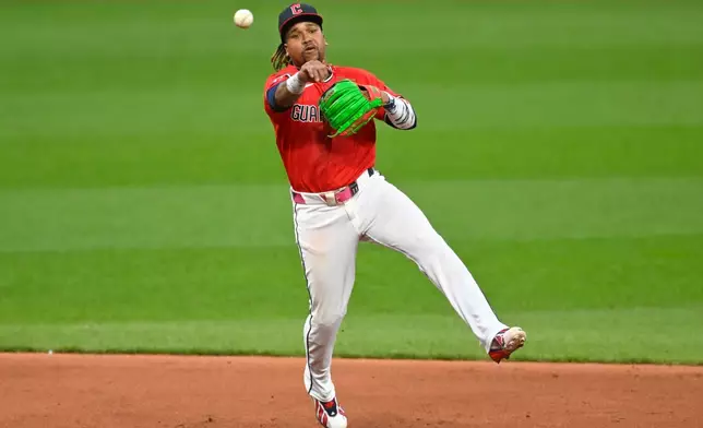 Cleveland Guardians third baseman Jose Ramirez (11) throws to first base in the sixth inning of a baseball game against the Houston Astros in Cleveland, Tuesday, April 21, 2026. (AP Photo/David Richard)