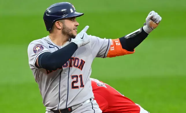Houston Astros' Yainer Diaz celebrates his double in the fifth inning of a baseball game against the Cleveland Guardians in Cleveland, Tuesday, April 21, 2026. (AP Photo/David Richard)