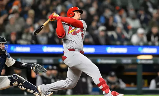 St. Louis Cardinals' Nolan Gorman watches after hitting a sacrifice fly in the eighth inning of a baseball game against the Detroit Tigers, Sunday, April 5, 2026, in Detroit. (AP Photo/Jose Juarez)