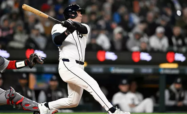 Detroit Tigers' Kerry Carpenter hits a two-run home run in the third inning of a baseball game against the St. Louis Cardinals, Sunday, April 5, 2026, in Detroit. (AP Photo/Jose Juarez)