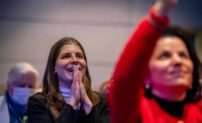 Employees of the Canadian Space Agency react during the successful launch of the Artemis II moon mission, at the Canadian Space Agency, in Longueuil, Quebec, on Wednesday, April 1, 2026. (Christopher Katsarov/The Canadian Press via AP)