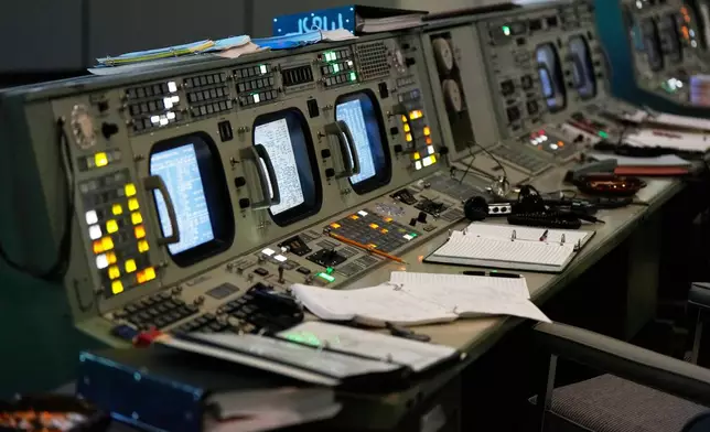 Artifacts sit in the Apollo Mission Control room at Johnson Space Center on Thursday, July 24, 2025, in Houston. (AP Photo/Ashley Landis)