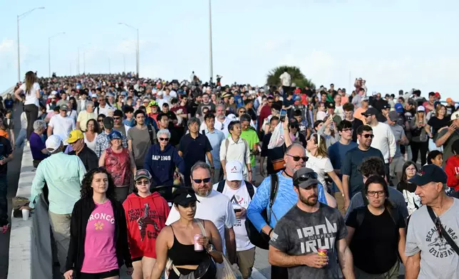 Spectators leave the A. Max Brewer Bridge after viewing NASA's Artemis II moon rocket launch, Wednesday, April 1, 2026, in Titusville, Fla. (AP Photo/Phelan M. Ebenhack)