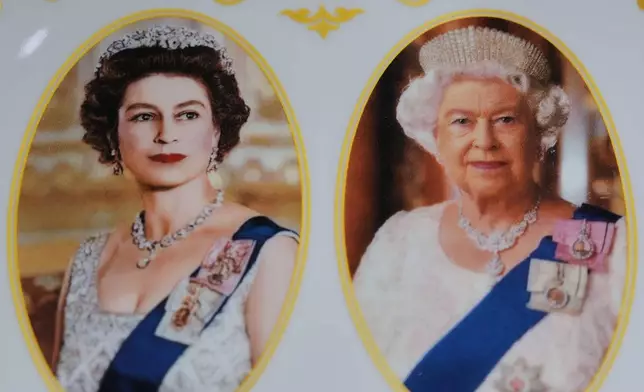 A plate with photos of late Queen Elizabeth II is on display for sale at a souvenirs shop in London, on April 17, 2026. (AP Photo/Kin Cheung)