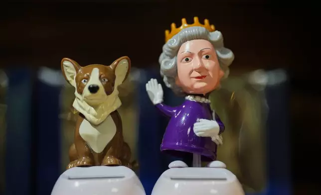Bobblehead of late Queen Elizabeth II is on display for sale at a souvenirs shop in London, on April 17, 2026. (AP Photo/Kin Cheung)