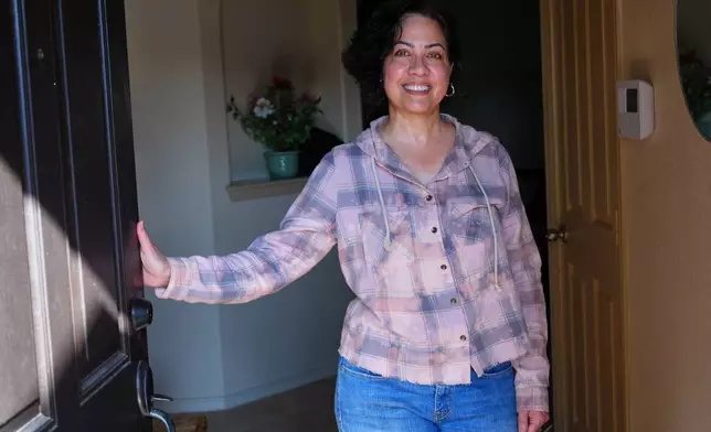 Anne King poses for a photo at the home she recently purchased, in Fort Worth, Texas, Tuesday, March 31, 2026. (AP Photo/LM Otero)