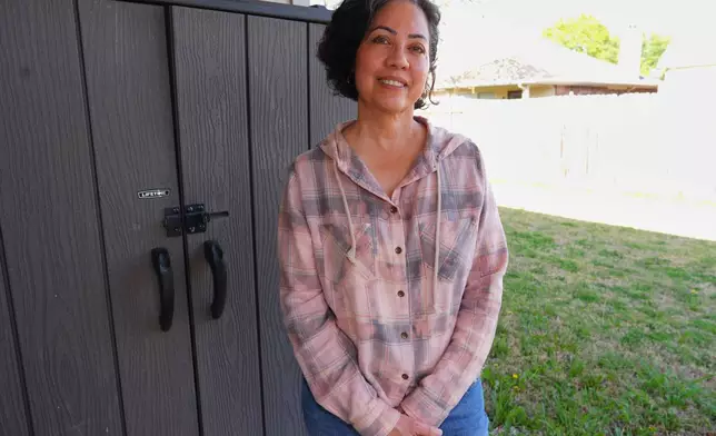 Anne King poses for a photo in the backyard of the home she recently purchased, in Fort Worth, Texas, Tuesday, March 31, 2026. (AP Photo/LM Otero)