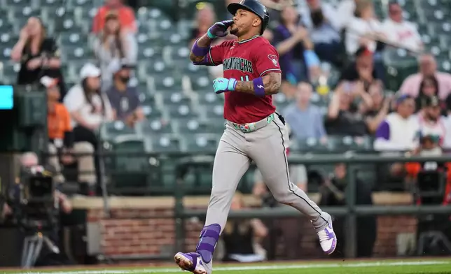 Arizona Diamondbacks' Ketel Marte rounds the bases after hitting a home run during the third inning of a baseball game against the Baltimore Orioles, Monday, April 13, 2026, in Baltimore. (AP Photo/Stephanie Scarbrough)