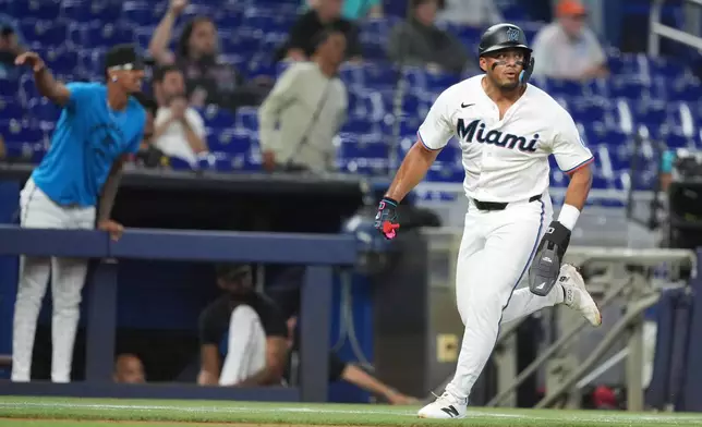 Miami Marlins' Leo Jimenez runs home on a single by Jakob Marsee during the fourth inning of a baseball game against the St. Louis Cardinals, Wednesday, April 22, 2026, in Miami. (AP Photo/Rebecca Blackwell)