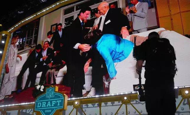 Indiana quarterback Fernando Mendoza is shown on a screen after being chosen by the Las Vegas Raiders with the first overall pick during the first round of the NFL football draft, Thursday, April 23, 2026, in Pittsburgh. (AP Photo/Gene J. Puskar)